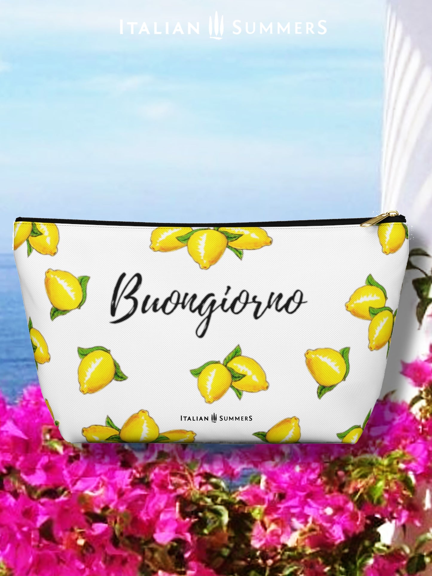 clutch BUONGIORNO LIMONI. Inspired by the sunny, Mediterranean vibes of Italy, this clutch is decorated with playful, happy Sorrento lemons and the classic Italian greeting of "Buongiorno".
