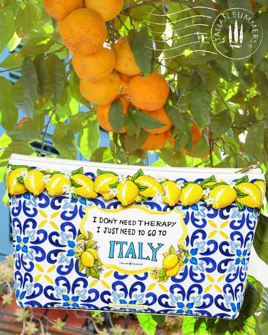 Italy inspired Clutch with  Lemons and blue Italian  Tiles  with the quote I don't need Therapy I just need to go to Italy in the front center  inside a crest with flanking Sorrento lemons with flowers. Made by Italian Summers