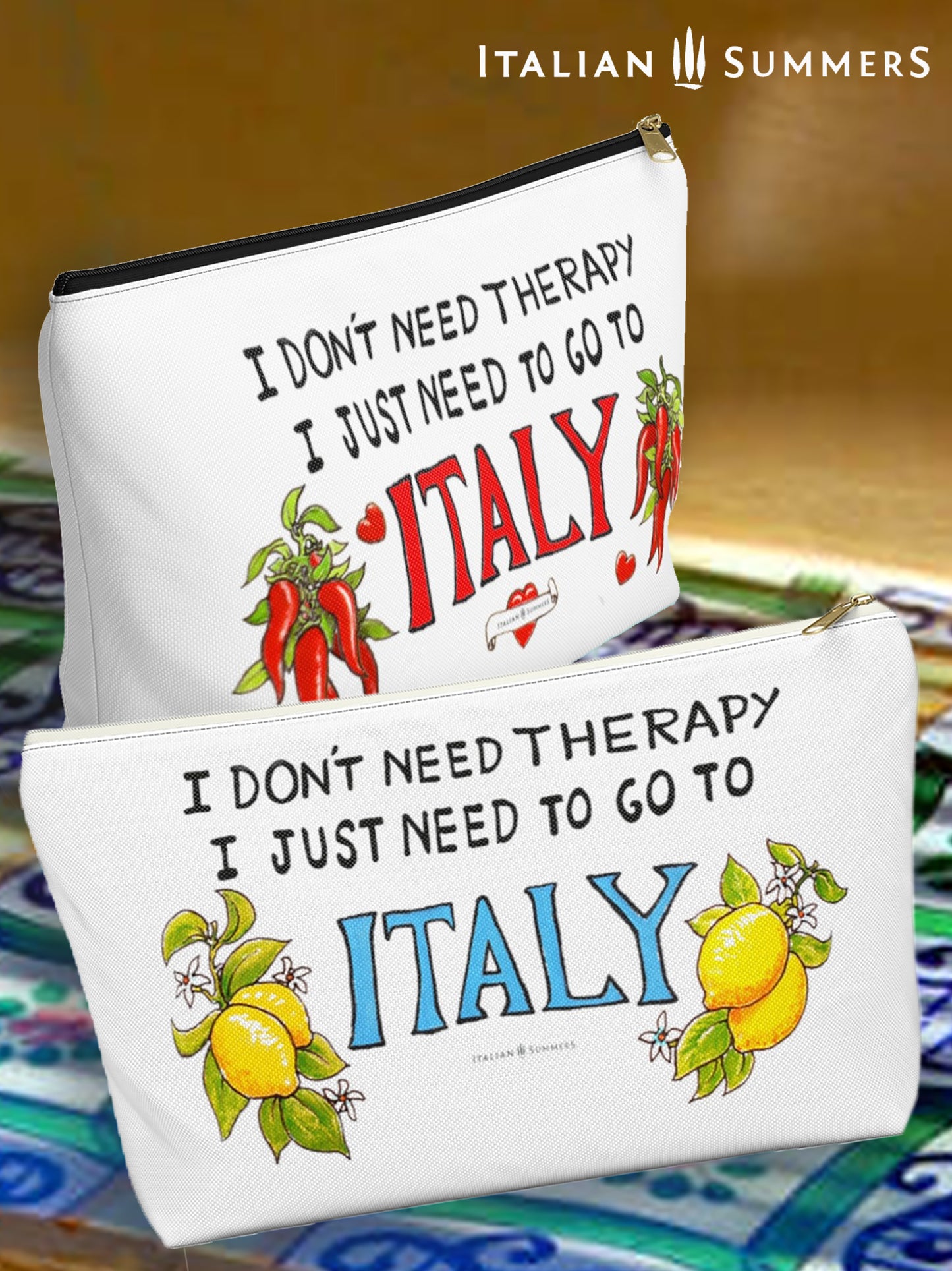 Italy inspired white canvas clutch with the quote I don't need therapy, I just need to go to Italy. The quote is in handwritten with the word Italy in red. On both sides of Italy there are bundles of peppers. The clutch has a black zipper that fits with the black text. Designed by Italian Summers