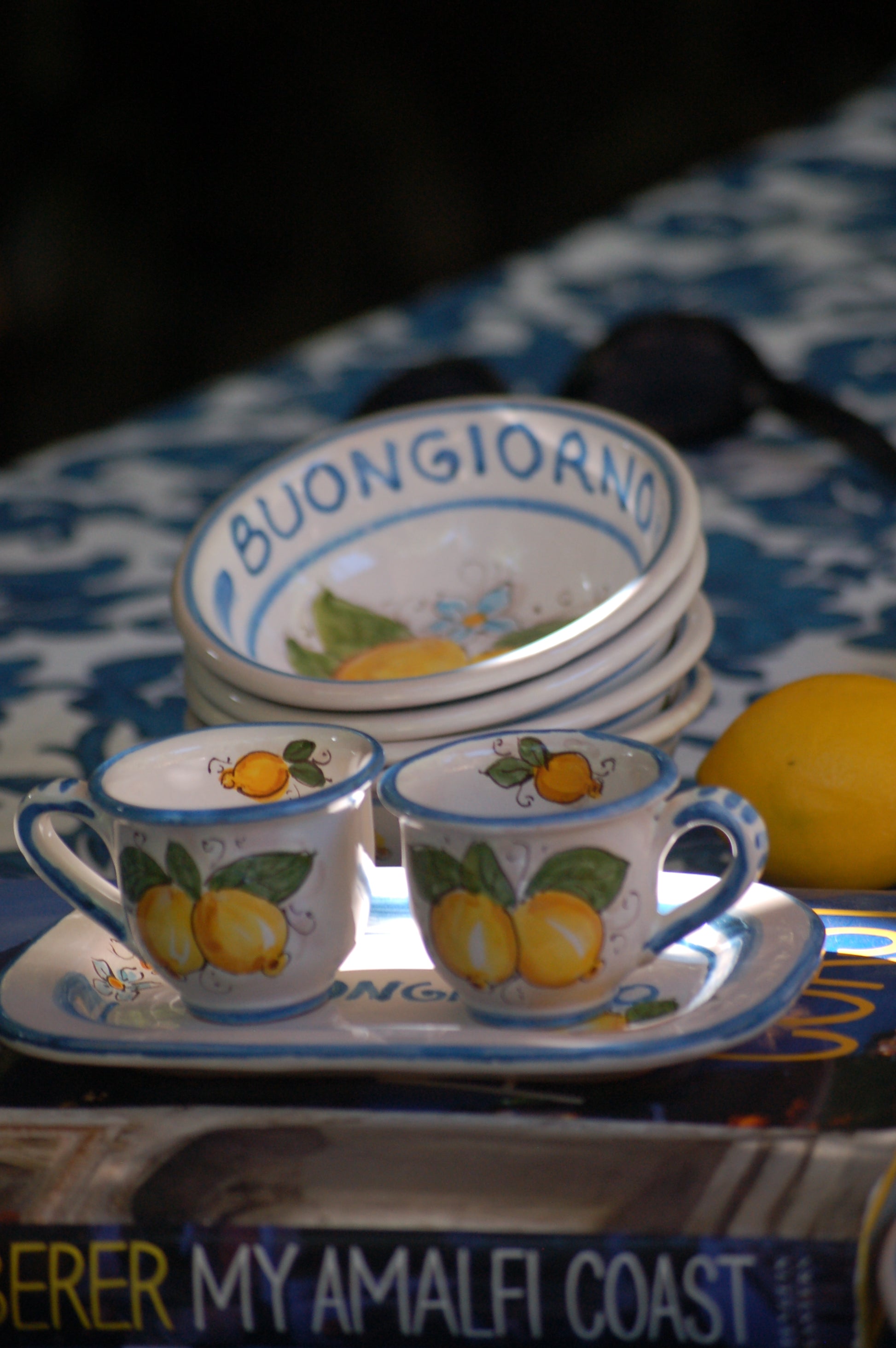 Italian ceramic breakfast set made up of two espresso cups with a tray, and wo bowls. All decorated with light marine blue stripes and vibrant hand painted Amalfi Coast lemons. The tray has the tex: "La vita e' piu bella con te" (life is more beautiful with you) or "Buongiorno" Artisan-made on the island of Sicily