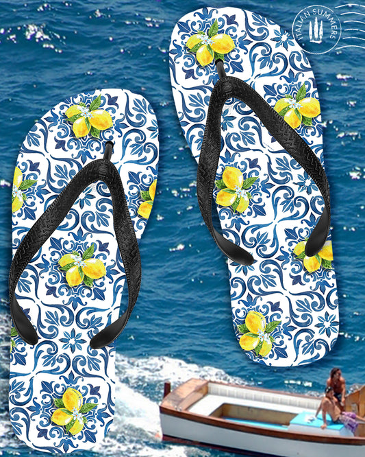 Italy flip flops inspired by Italian Sicilian maiolica tiles. On the flip flop a combination of blue Italian tiles and Amalfi Coast lemons. The straps are black. Made by Italian Summers 