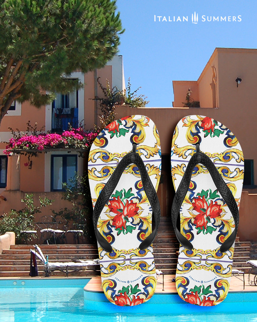 Italy inspired flip flops with Sicilian maiolica tiles. White flip flops with a black strap. The design on the base of the flip flops are large Sicilian tiles . Main colors are white, red, gold, green and blue. Made by Italian Summers.