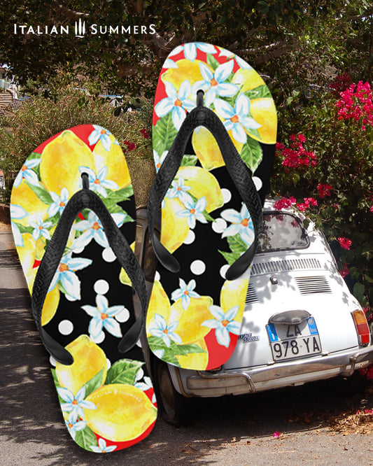 Italy inspired Flip Flops with bunches of Sorrento Lemons and lemon flowers over a field ow white polka dots and a black backround. Made by Italian Summers