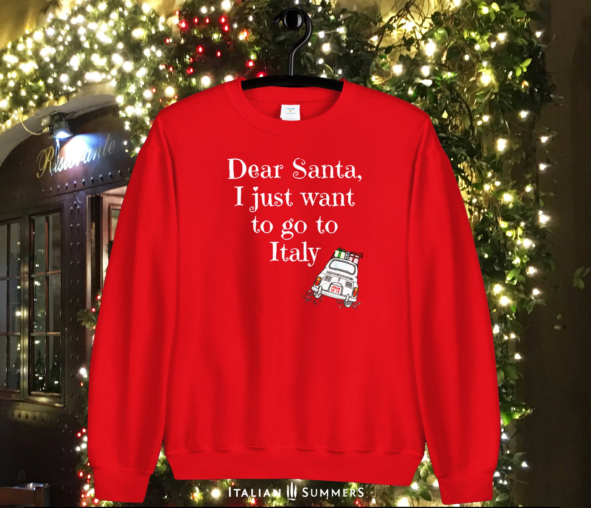 A  soft, comfy and cozy Italy-Christmas inspired sweatshirt. It features the fun phrase: "Dear Santa, I just want to go to Italy", and a vintage Fiat 500 speeding away loaded with wrapped Christmas gifts: Buon Natale!