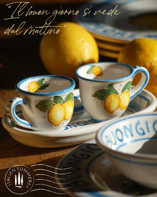 A bright and colorful Italian Maiolica ceramic espresso coffee set, two demitasse and a serving tray featuring sunny Sicilian lemons and a blue decoration with the text Buongiorno which means Good Morning in Italian.  hand made in Sicily