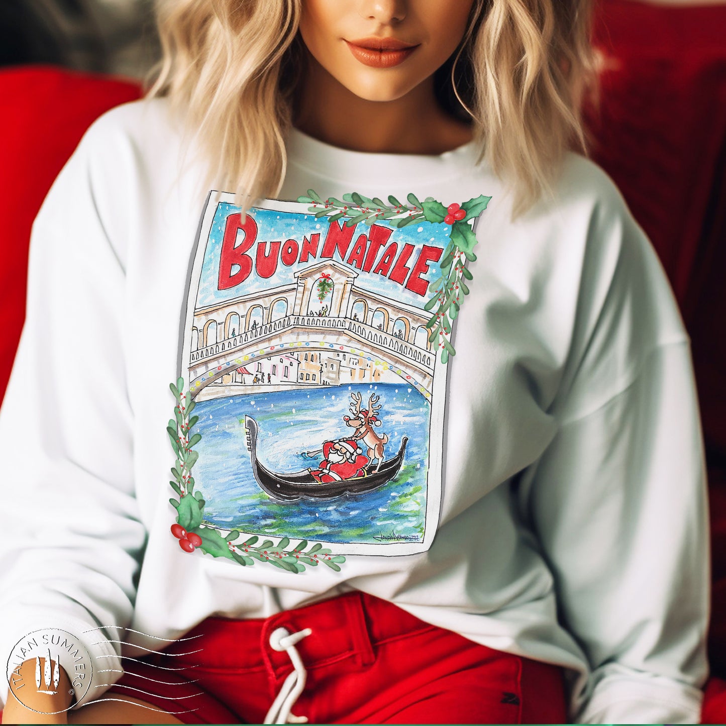 A girl is wearing a white sweatshirt with a print of a post-card design featuring Santa Claus in a gondola, being rowed by Rudolph the Reindeer, under the Rialto bridge in Venice, Italy