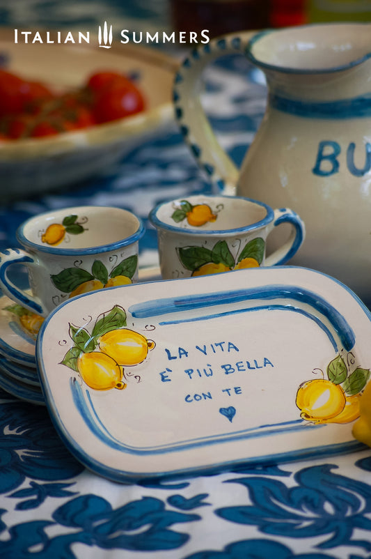 Italian ceramic breakfast set made up of two espresso cups with a tray, and wo bowls. All decorated with light marine blue stripes and vibrant hand painted Amalfi Coast lemons. The tray has the tex: "La vita e' piu bella con te" (life is more beautiful with you) or "Buongiorno" Artisan-made on the island of Sicily