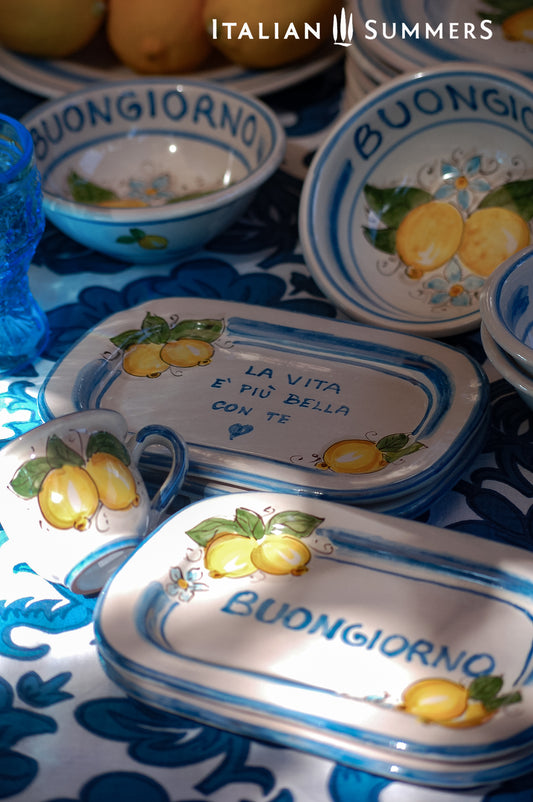 Italian ceramic breakfast set made up of two espresso cups with a tray, and wo bowls. All decorated with light marine blue stripes and vibrant hand painted Amalfi Coast lemons. The tray has the tex: "La vita e' piu bella con te" (life is more beautiful with you) or "Buongiorno" Artisan-made on the island of Sicily