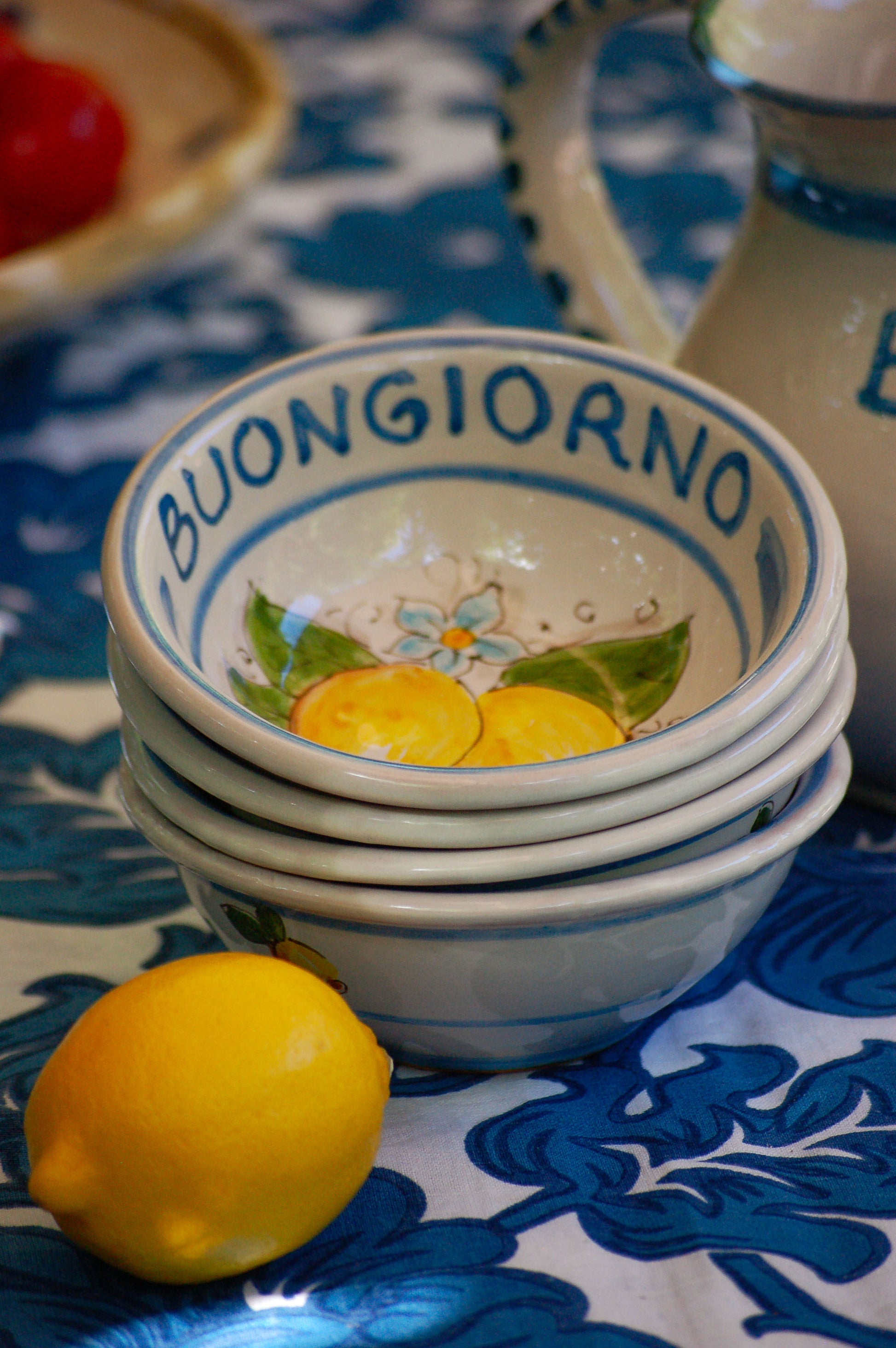 Italian ceramic lemon bowls with the text Buongiorno. The Amalfi coast lemons are hand painted on the inside of the bowl and the word Buongiorno is on the inside on the top of the rim. By Italian Summers