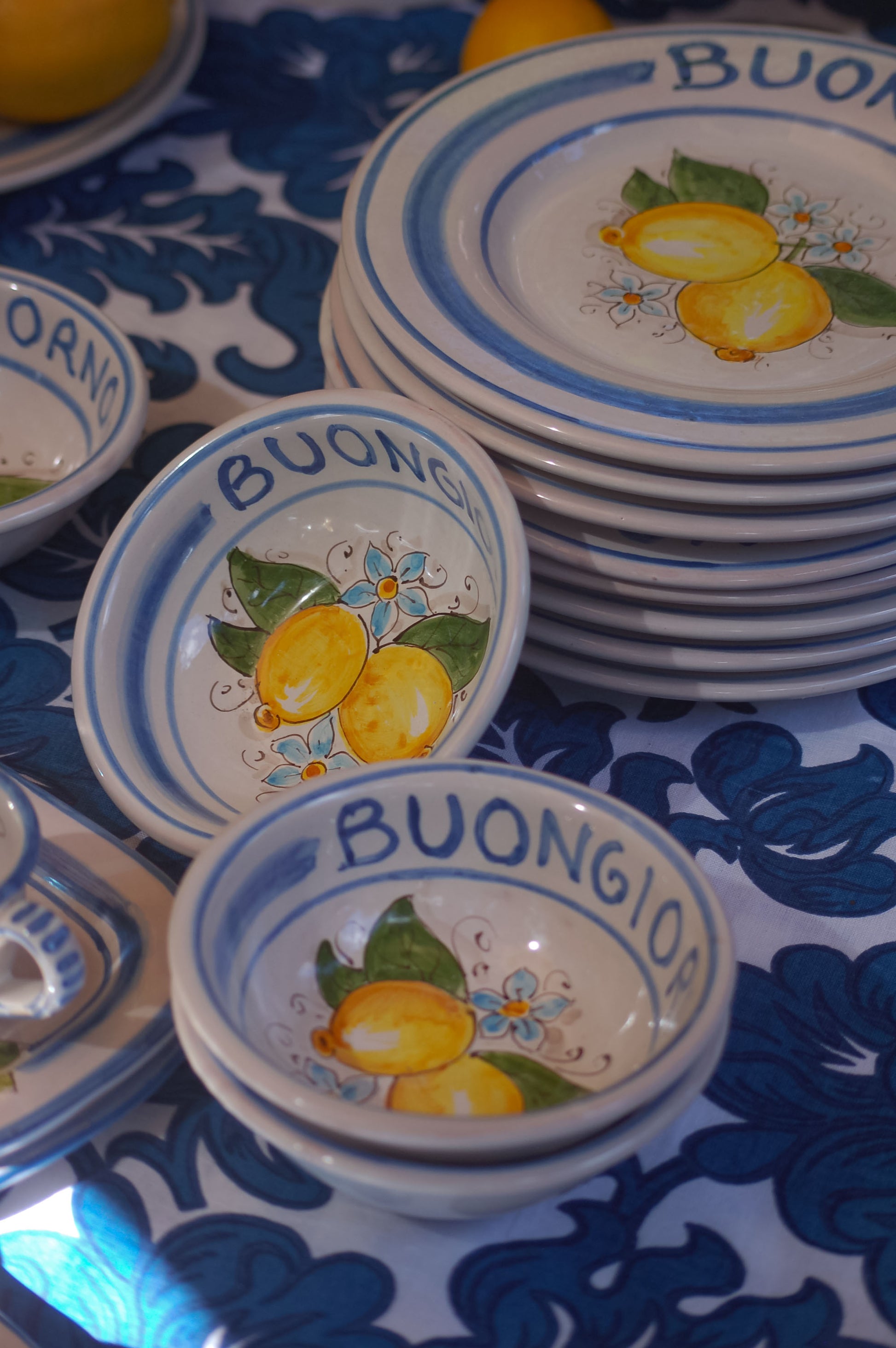 Italian ceramic lemon bowls with the text Buongiorno. The Amalfi coast lemons are hand painted on the inside of the bowl and the word Buongiorno is on the inside on the top of the rim. By Italian Summers