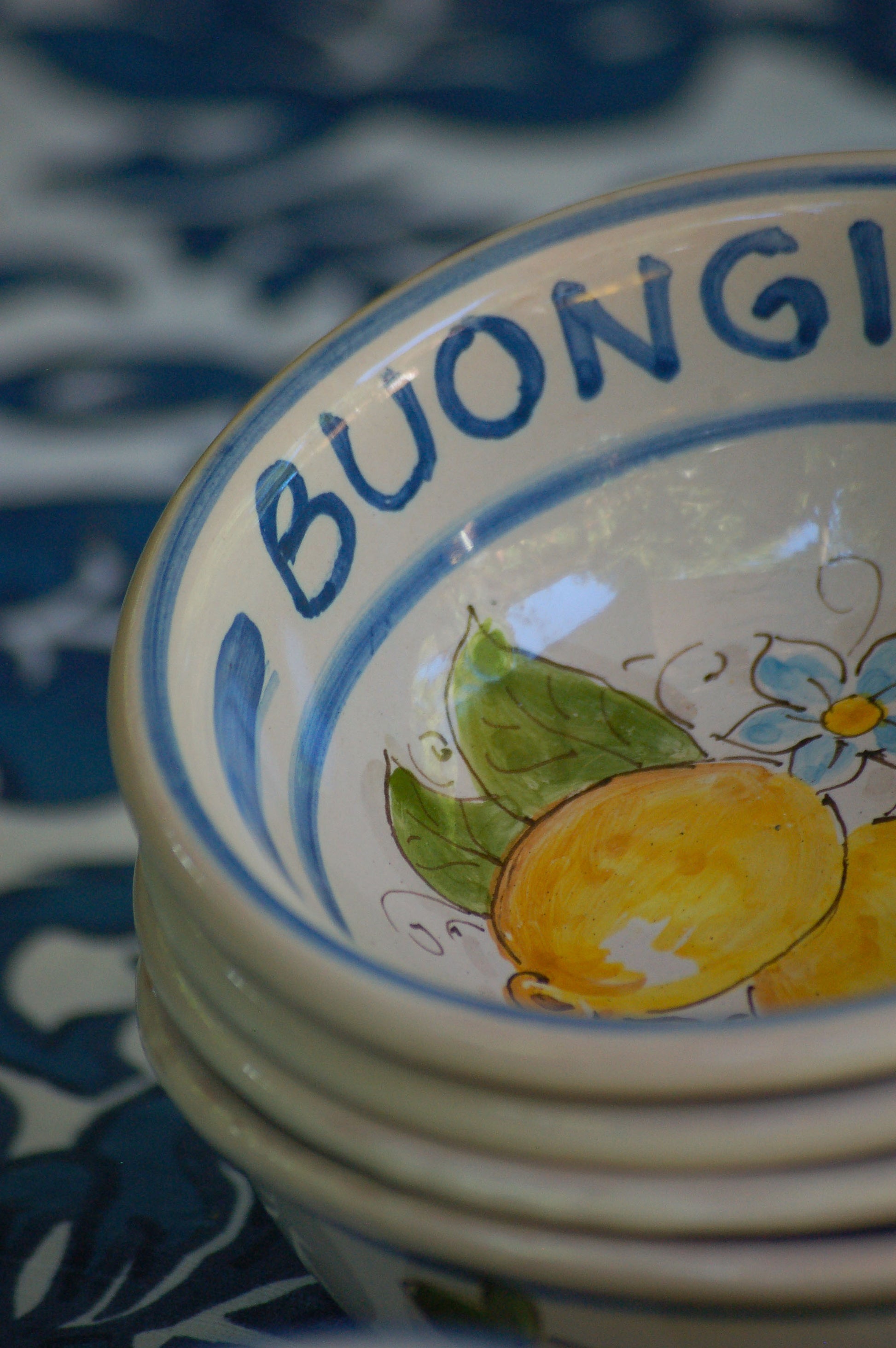 Italian ceramic lemon bowls with the text Buongiorno. The Amalfi coast lemons are hand painted on the inside of the bowl and the word Buongiorno is on the inside on the top of the rim. By Italian Summers
