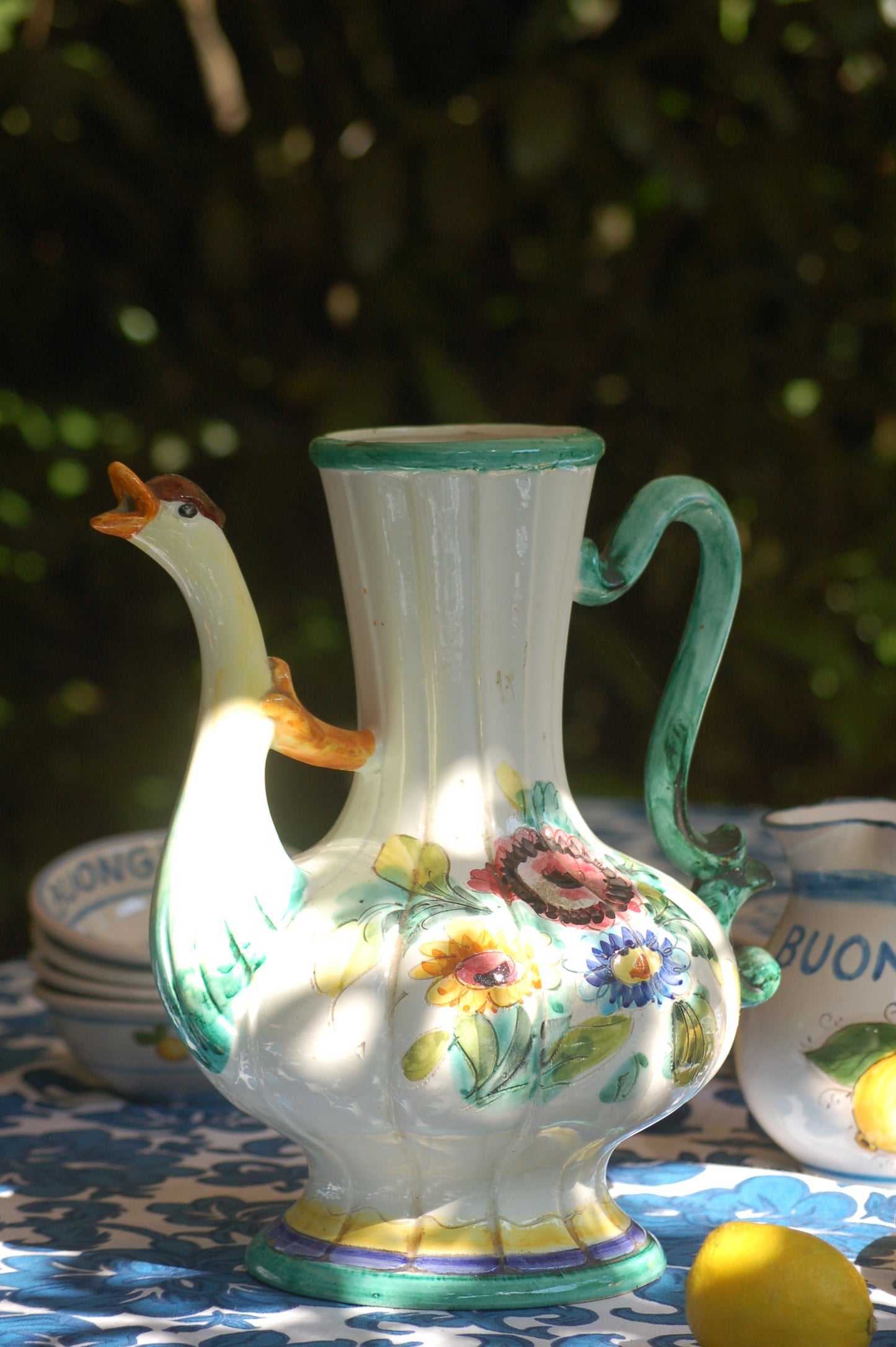 Italian vintage carafe decorated with flowers and goose head from the sixties side view 2