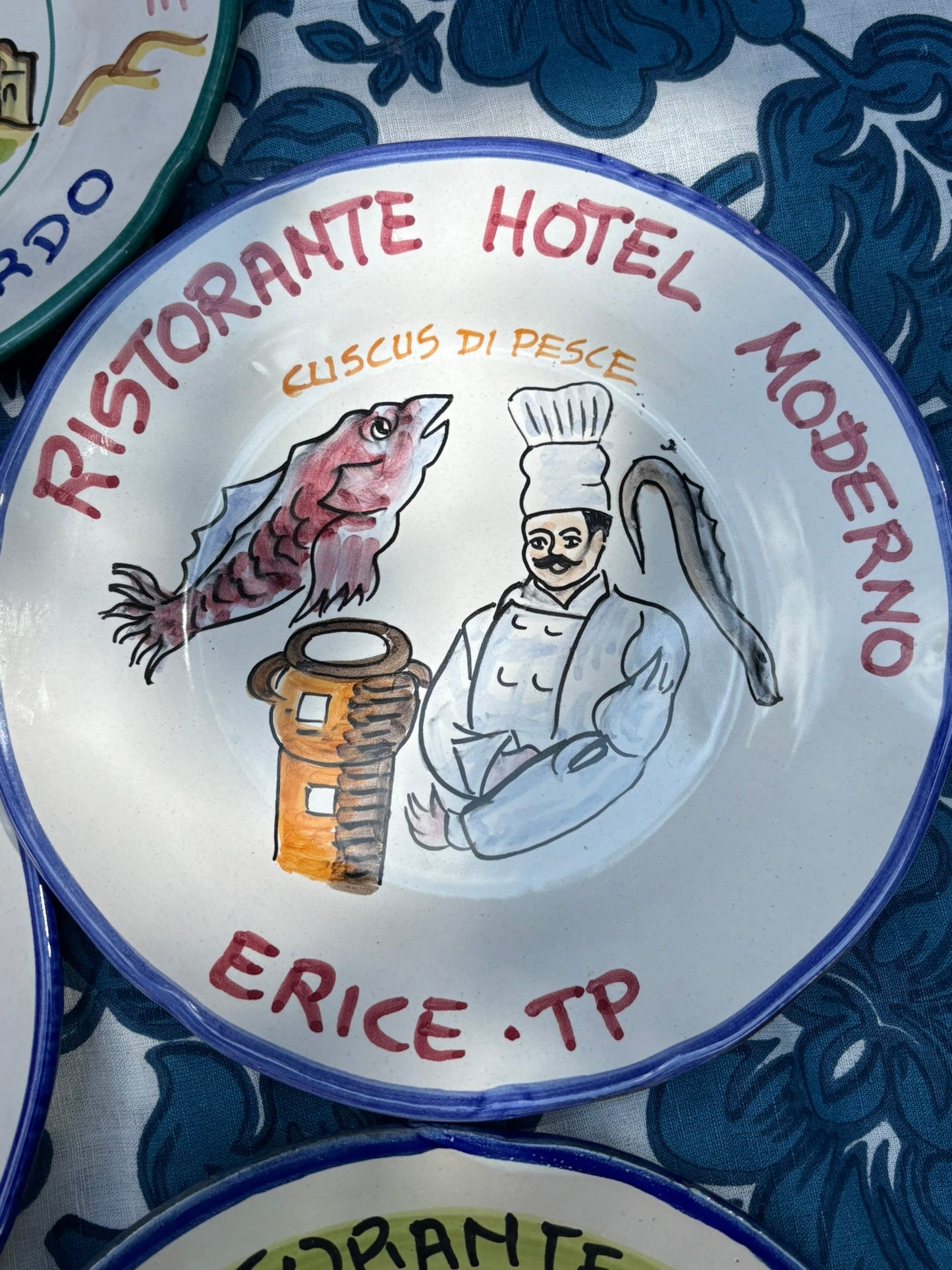 Italian  ceramic restaurant plate with handpainted Italian restaurant illustration and  the text Risotante hotel Moderno ERice Trapani