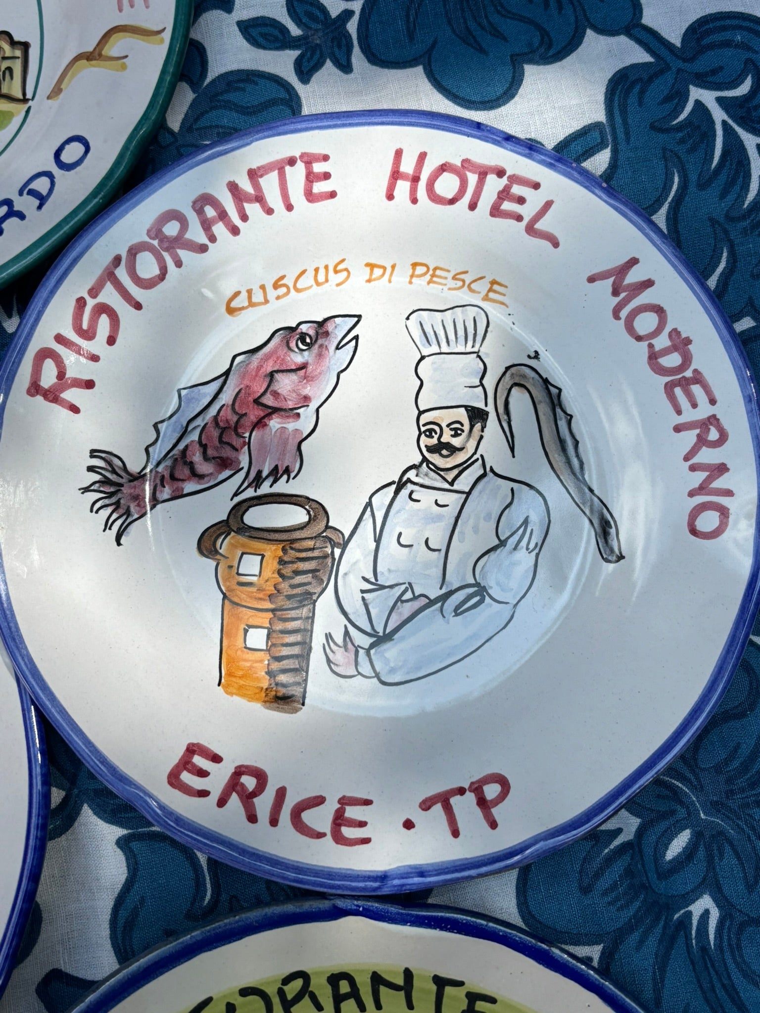 Italian  ceramic restaurant plate with handpainted Italian restaurant illustration and  the text Risotante hotel Moderno ERice Trapani