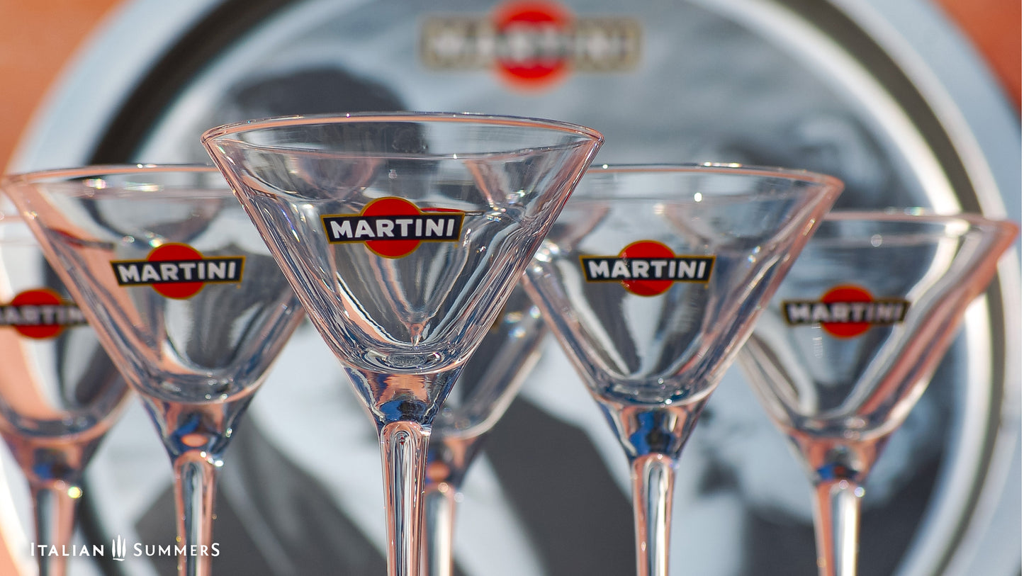 Martini glasses with the Martini brand logo on a blurred background