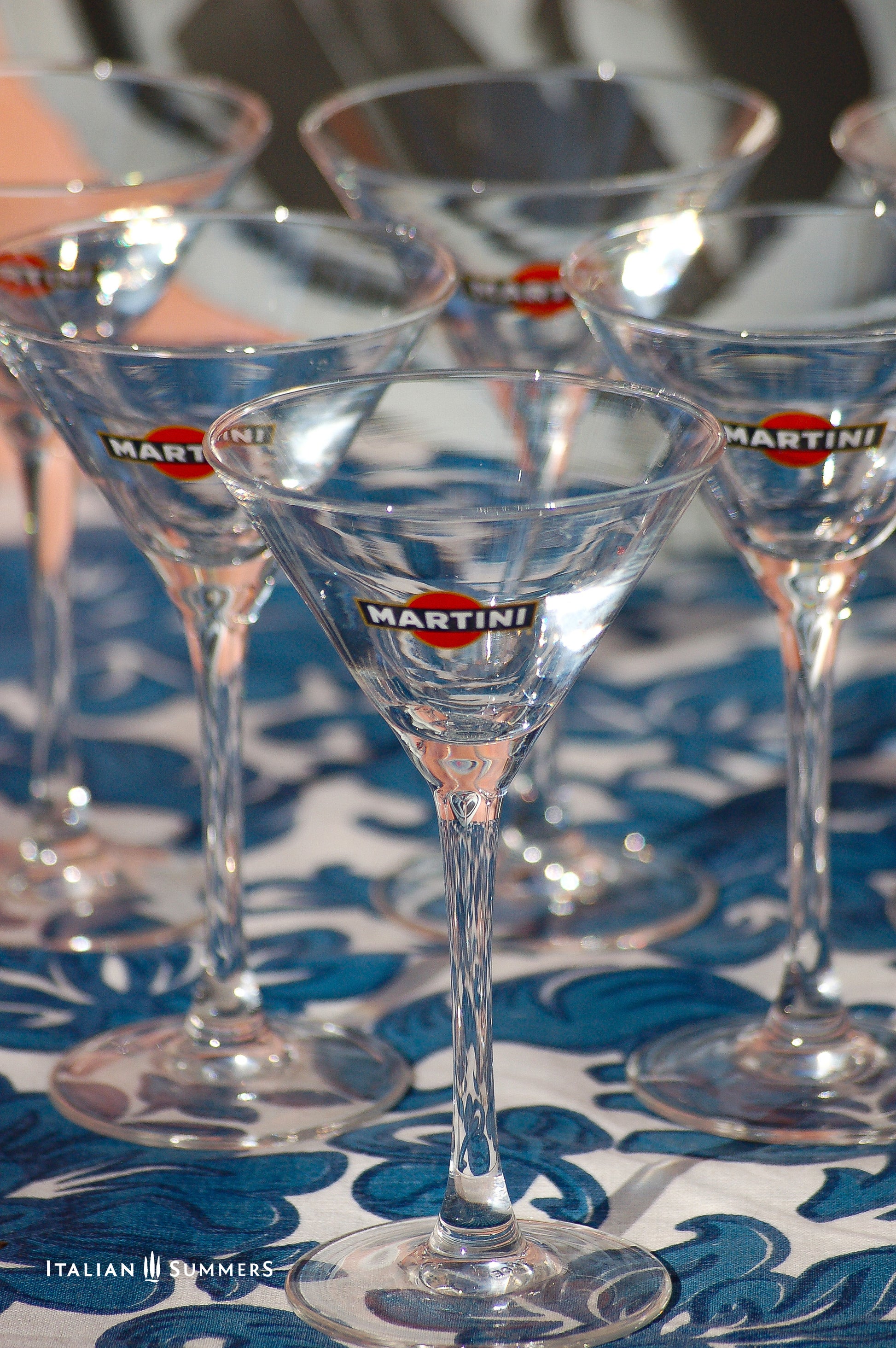Set of Martini glasses on a blue and white patterned tablecloth