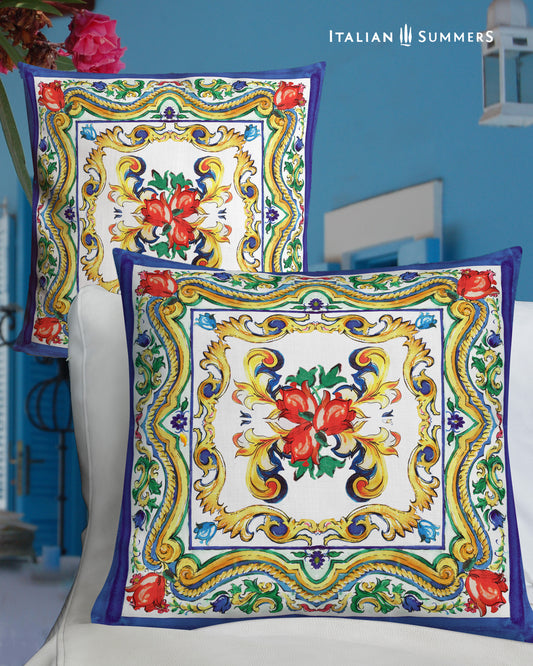 Italy inspired pillow cover with a print of a big Italian Sicilian maiolica tile and flowers. Main colors red, blue yellow and white. On the rim there is a blue trim. Very happy and lively Sicilian print. Made by Italian Summers