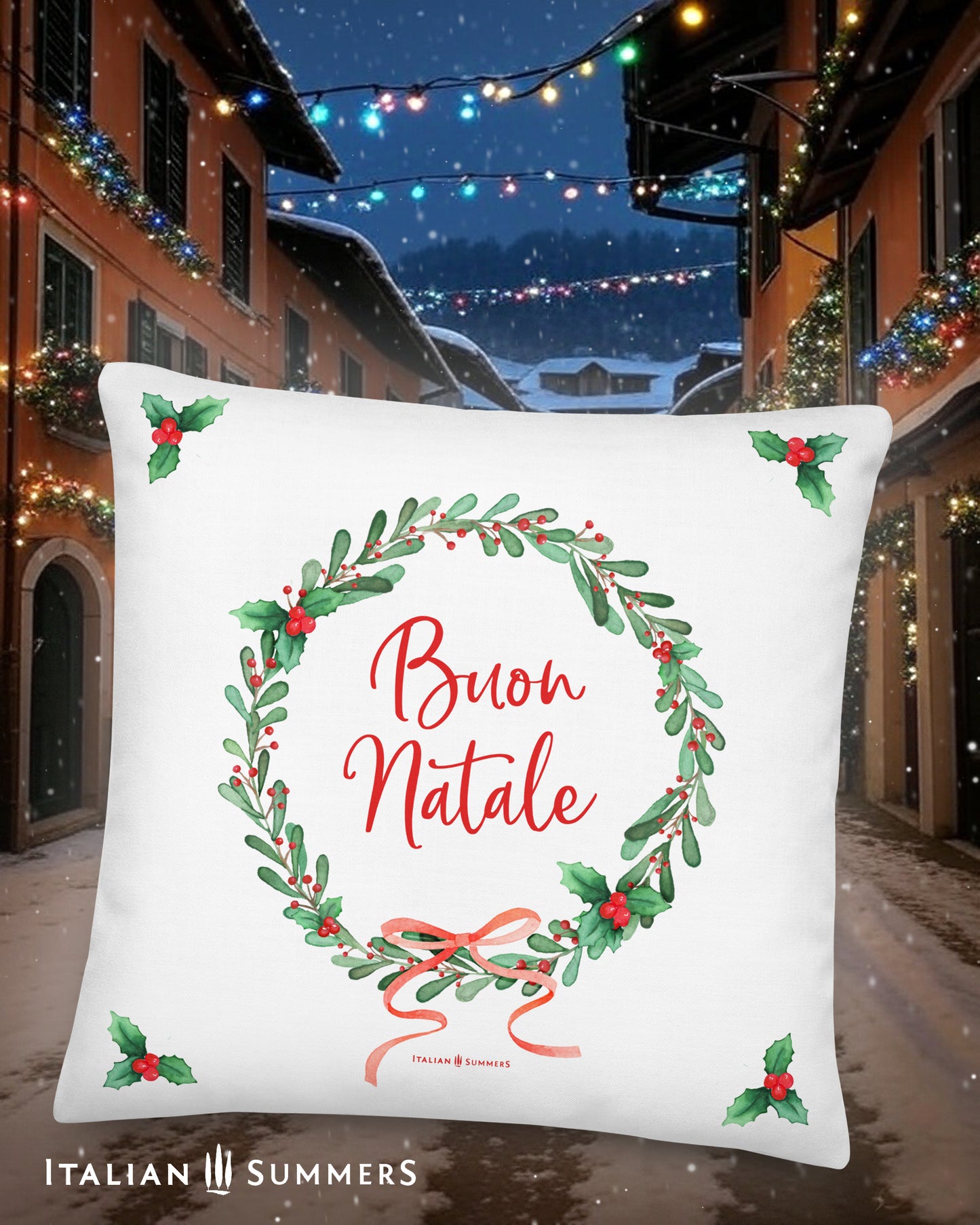 Decorative white  Italy pillow with 'Buon Natale' text and Christmas wreath design, set against a festive Italian village street background.