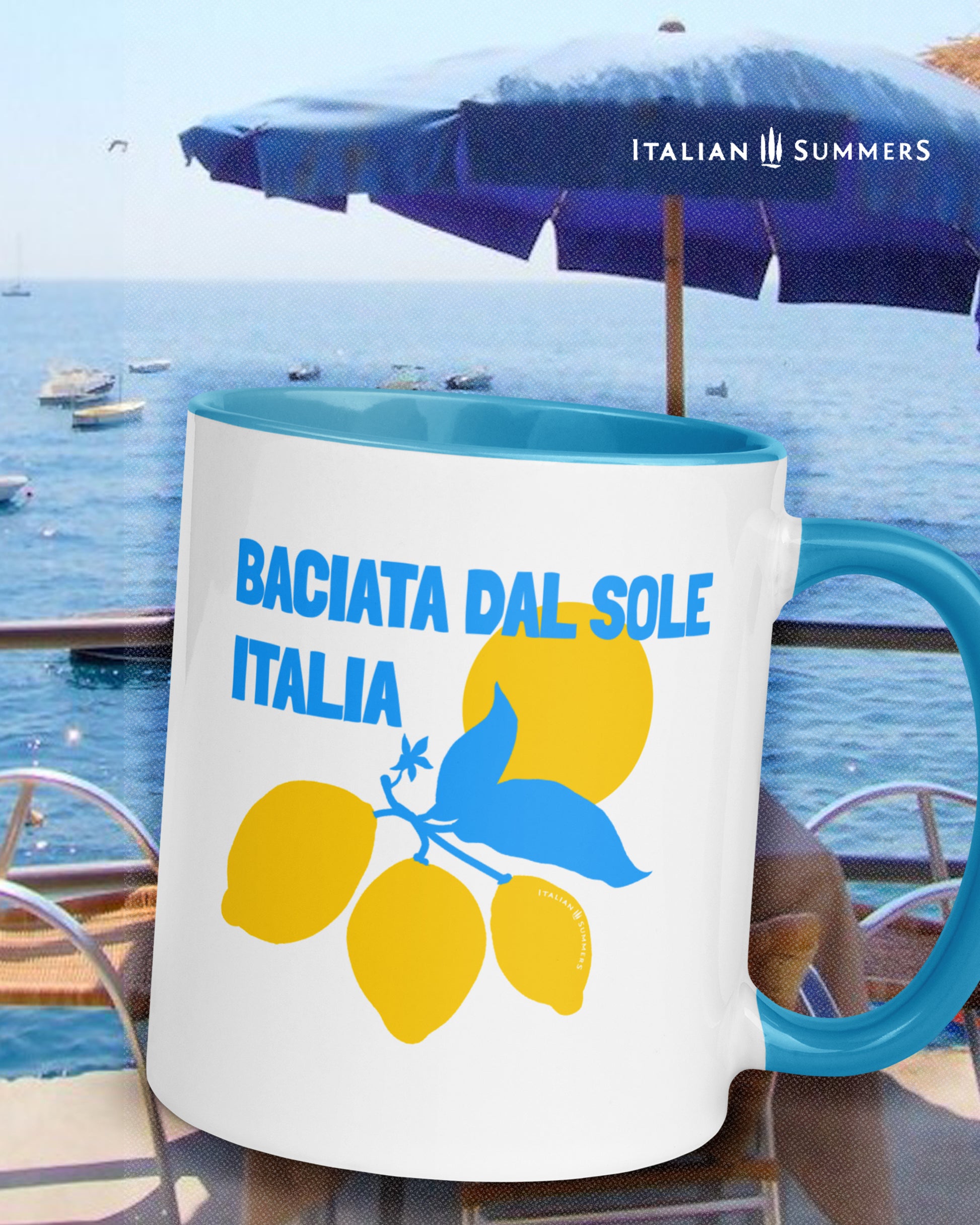 Italian inspired mug with the text Baciata dal Sole with the word Italian under it. Freaturing a stylized with Amalfi coast lemons and the sun. Available whith a blue or a yellow insidean handle. Designed and sold by Italian  Summers