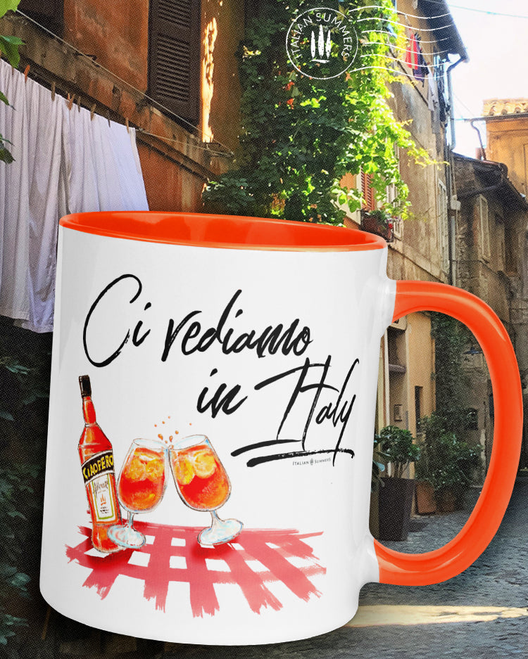 Mug "Ci vediamo in Italy" by Italian Summers! It represents a colorful sketch of a checkered tablecloth with a bottle and glasses of Aperol Spritz which gives you the Italian osteria vibes. And the quote Ci vediamo in Italy which means 'See you in Italy" Available in red, pink,, orange. By Italian Summers