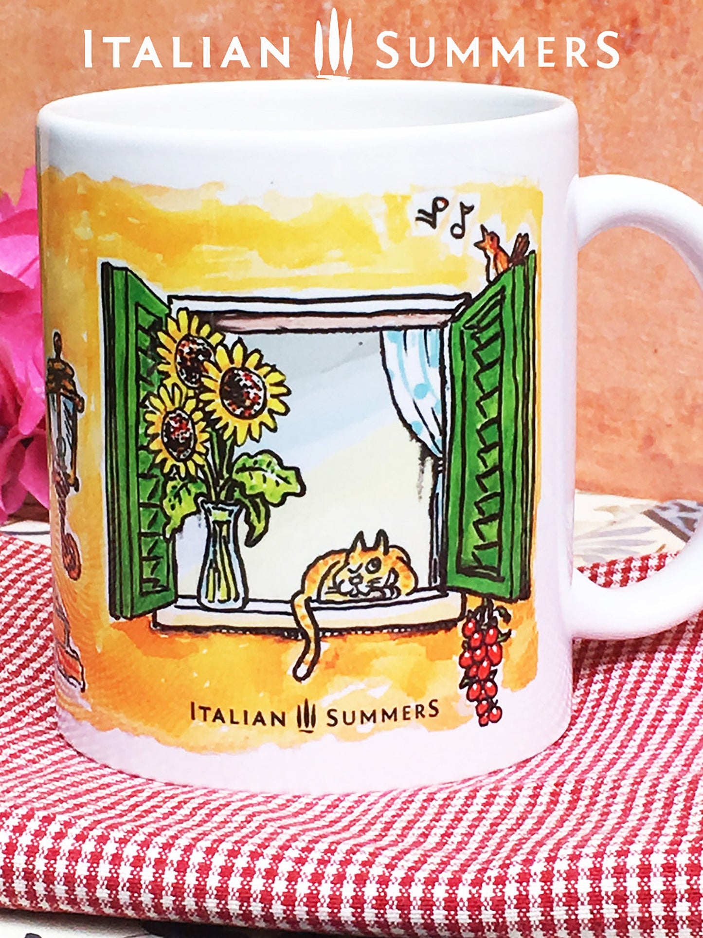 Italy inspired mug by sketches of an open Italian window. The window has green shutter, on the lower part of the windows hangs laundry in the color of the Italian flag. In the window sill ther is a red coffee mug and an Italian coffee poet, la moka. The Italian window is surrounded by a terracotta wall. Above the window there is written 'Buongiorno Italia' in black handwriting. Made by Italian Summers