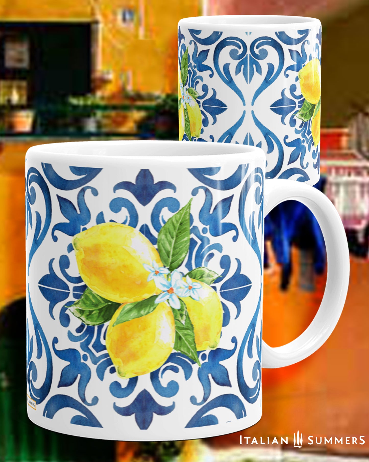 Italy inspired white ceramic mug with blue hande and interior. Italian blue tile pattern printed on the outside with bunches of sunny Sorrento lemons with flowers . Made by Italian Summers