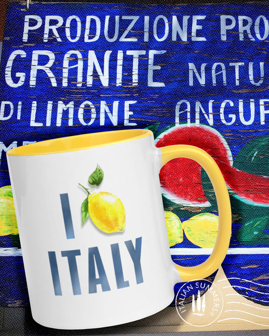 Italy inspired mug with the text I love Italy. The word love has been replaced with a nice Amalfi coast lemon. The text is in a slightly faded navy blue. The mug is available in yellow, blue and pink. Printed on both sides. Made by Italian Summers.