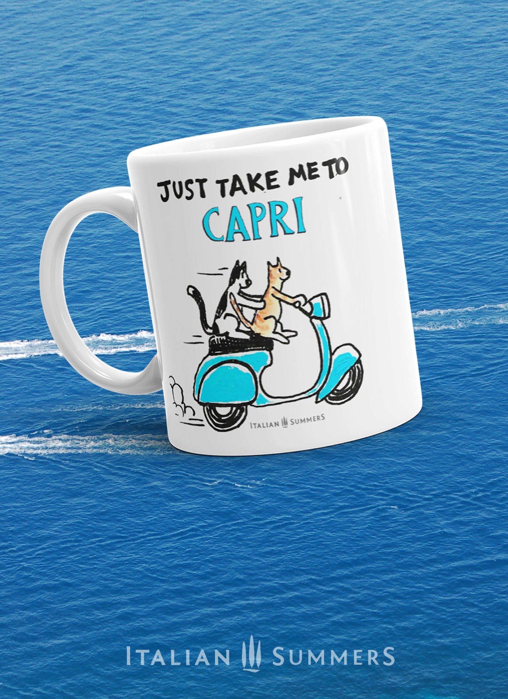 An Italy inspired coffe mug with the text Just take me to Capri. With a sketch of two cats driving an aqua blue vintage Vespa. The mug is avai;able in white or with a yellow or blue inside/handle. Made by Italian Summers