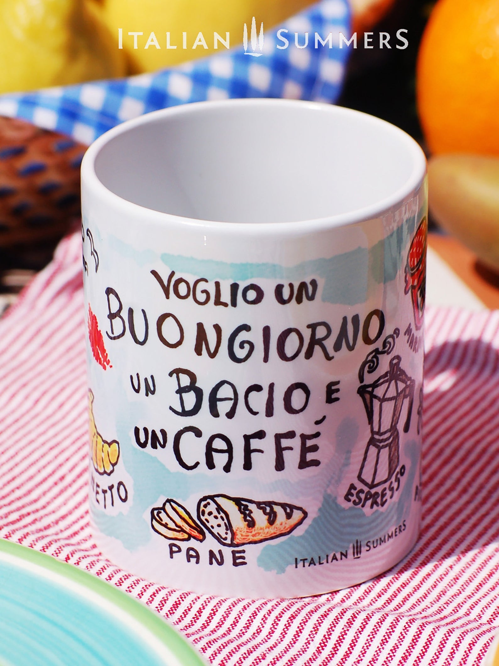 Italy inspired mug with the Italian title Voglio un Buongiorno, un Bacio e un caffe. The mug has a soft blue background and cute little sketches of items conected to Italian breackfast. A kiss, coffe, bread. Made by Italian Summers