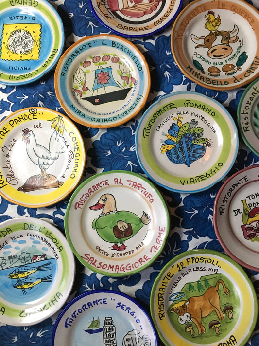 a group of Hand painted Piatto_buon_Ricordo_vintage_Italian_restaurant_plates_from_Italy_by_Italian_Summers