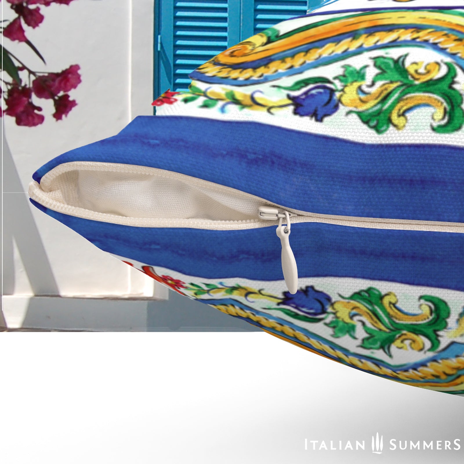 Italy inspired pillow cover with a print of a big Italian Sicilian maiolica tile and flowers. Main colors red, blue yellow and white. On the rim there is a blue trim. Very happy and lively Sicilian print. Made by Italian Summers