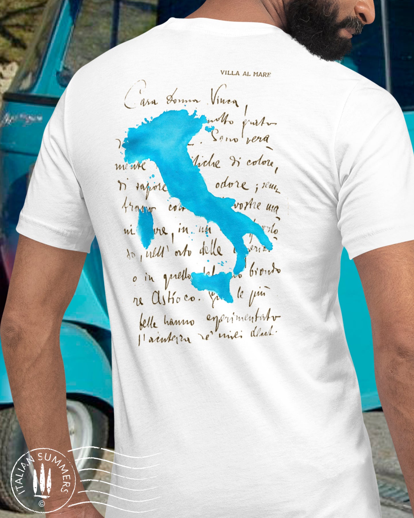 Italy Inspired T shirt with the print of a watercolor blue Italy shape over a hand-written letter from an  Italian Poet of the 1800s to an Italian Lady, the blue text ITALY is o the left sleeve, the blue watercolor shape of the country of Italy is on the left chest. Made by Italian Summers