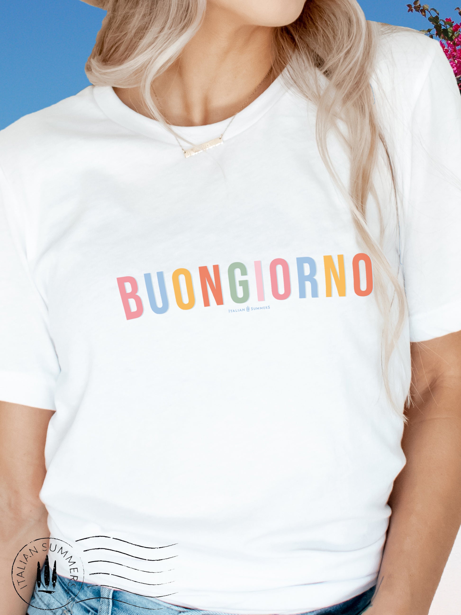 Itay inspired  white cotton T shirt with the Italian phrase " Buongiorno" printed in different soft pastel colors for each letter. A  subtle but stylish way to both wink at all Italy-lovers and to give a nice positive greeting to whomever reads it.