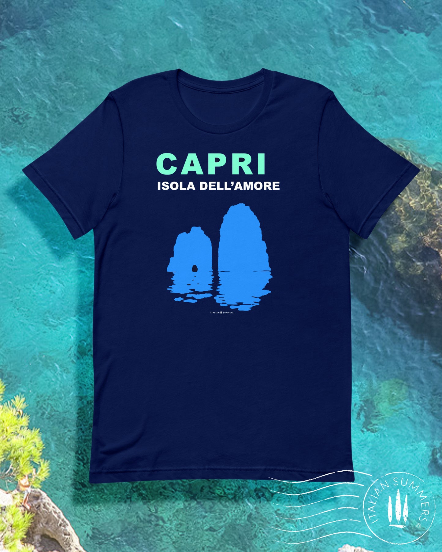 Italy inspired garment dyed T shirt with the aqua and white text: CAPRI, Isola dell'Amore (Capri, Iland of Love) with the silhouette  of the famous Faraglioni and their reflection upon the waters of the Mediterranean Sea. Made by Italian Summers