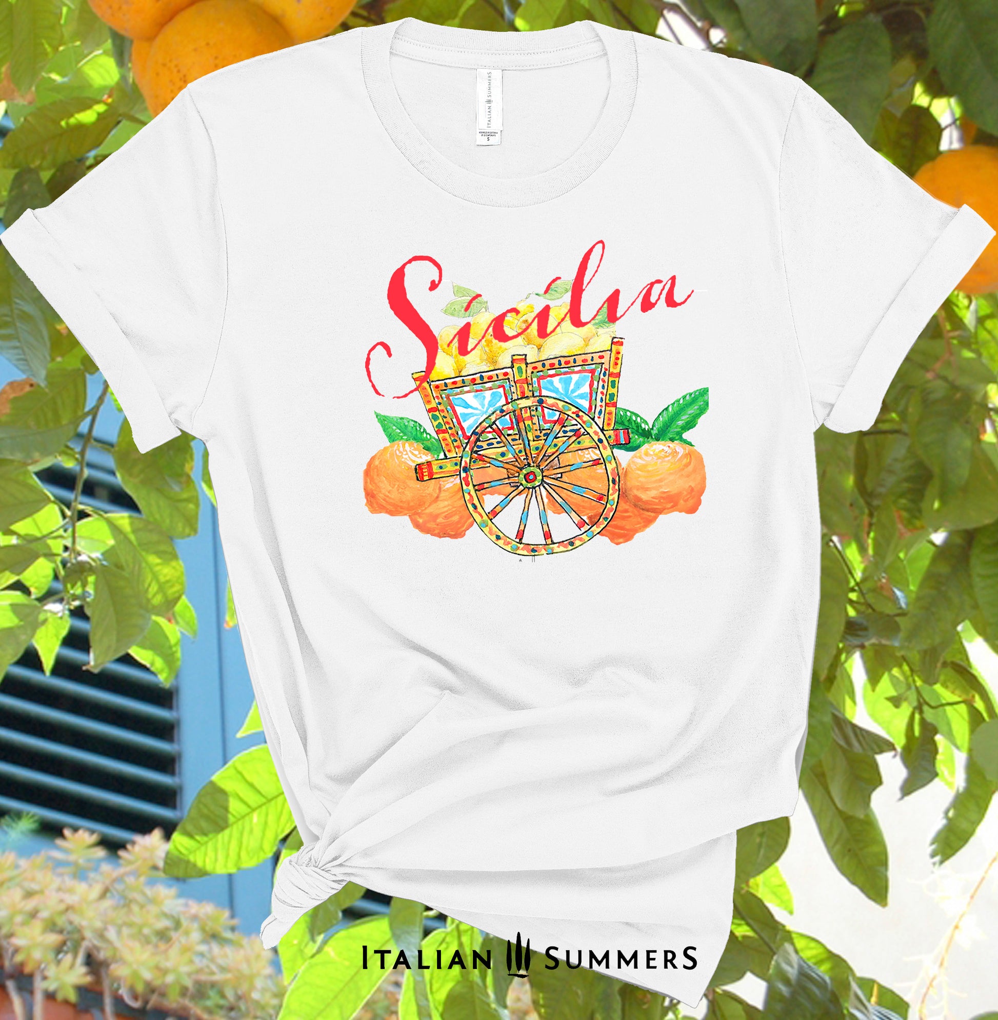Italy Inspired White or Navy T shirt with hand-painted design of a colorful Sicilian cart , Sicilian oranges and lemons. The word 'Sicilia' is printed in red over the composition. Italy gift, designed by an Italian , made by Italian Summers