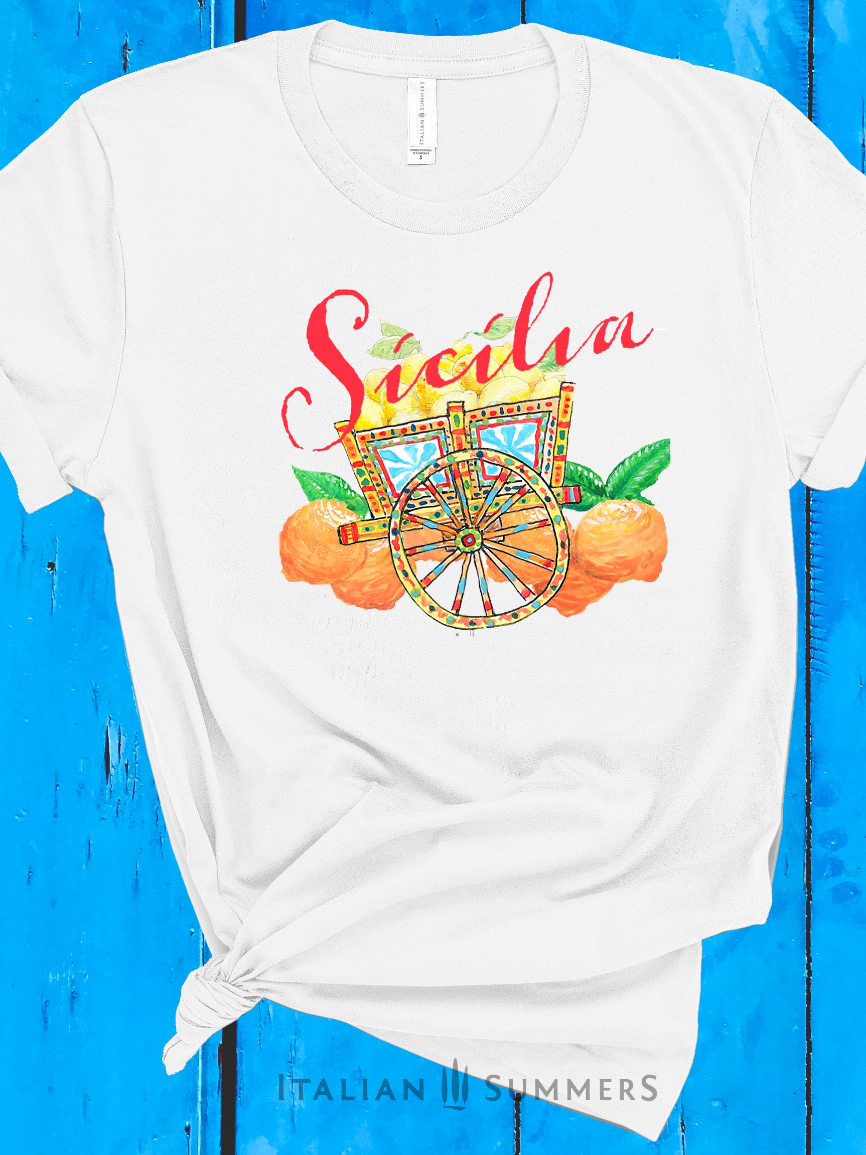 Italy Inspired White or Navy T shirt with hand-painted design of a colorful Sicilian cart , Sicilian oranges and lemons. The word 'Sicilia' is printed in red over the composition. Italy gift, designed by an Italian , made by Italian Summers