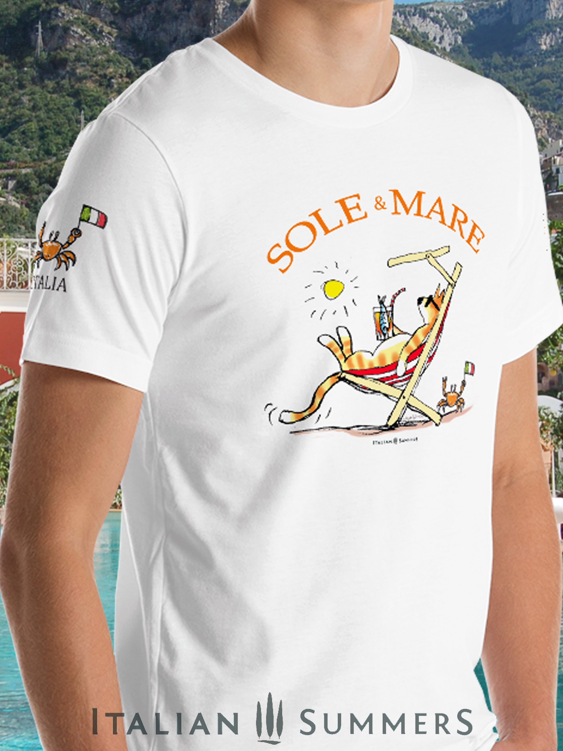 Italy inspired  White T Shirt our original drawing of a red cat on a beach chair sipping on a spritz and enjoying the sun in Italy. A cute crab on the sand waves a little Italian flag. Made by Italian Summers