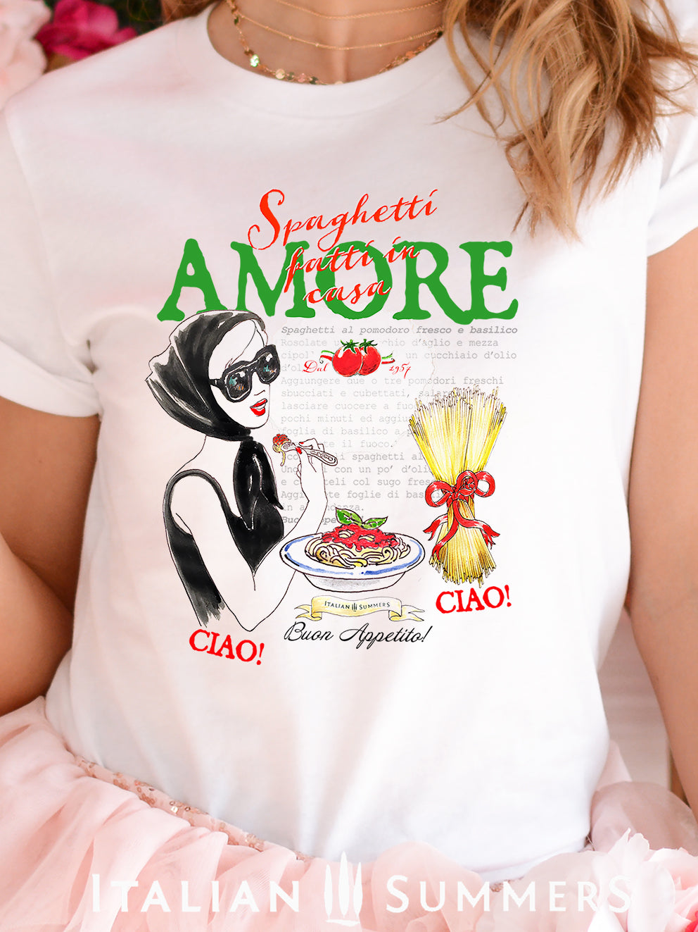 Italy-inspired  Italian food-inspired T shirt designed by Italian Summers. We included the drawing of a lady eating spaghetti while wearing a fashionable pair of glasses and the text " Spaghetti fatti in Casa- Amore" also features a recipe for 'spaghetti al pomodoro e basilico' text in the backround.