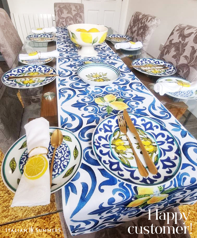 Italy inspired table runner printed with a blue and white pattern  of  Italian maiolica tiles and bundles of Sorrento lemons with flowers. A true Amalfi Coast decorational touch to any diningroom. Made by Italian Summers.