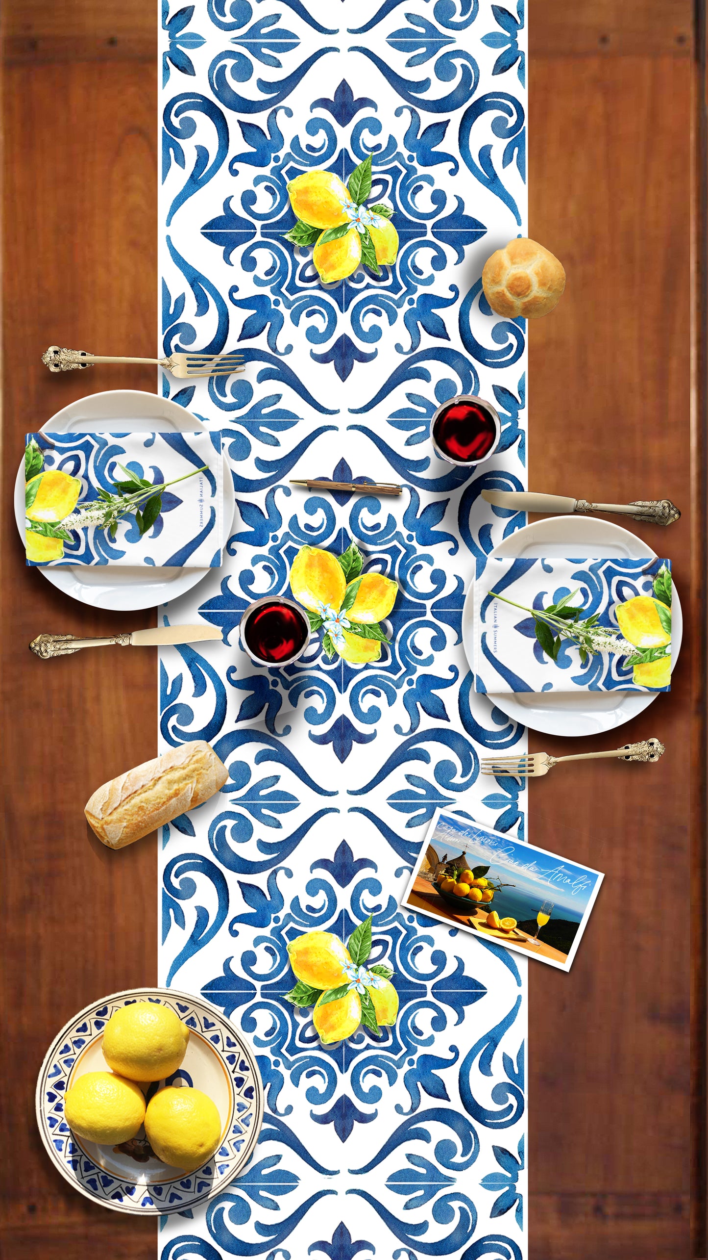 Italy inspired table runner printed with a blue and white pattern  of  Italian maiolica tiles and bundles of Sorrento lemons with flowers. A true Amalfi Coast decorational touch to any diningroom. Made by Italian Summers.