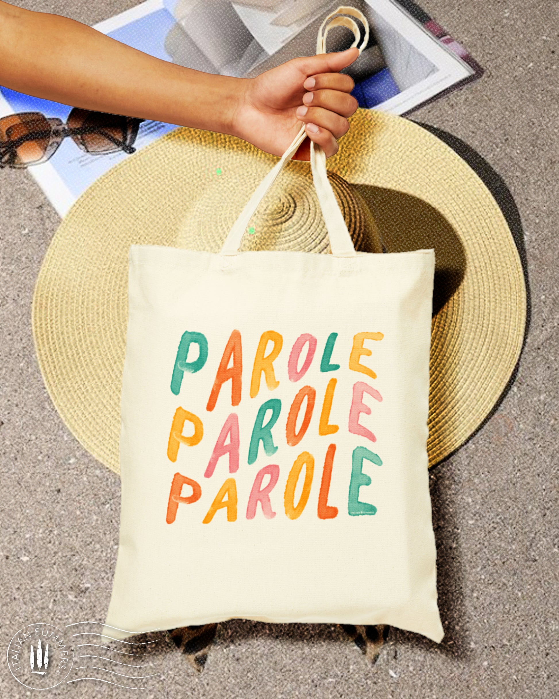A  happy-looking Natural Cotton Tote bag with the Italian quote 'Parole Parole Parole, printed with  hand-brushed multi-colored letters. Perfect for the beach, shopping or just a stroll in the Piazza.