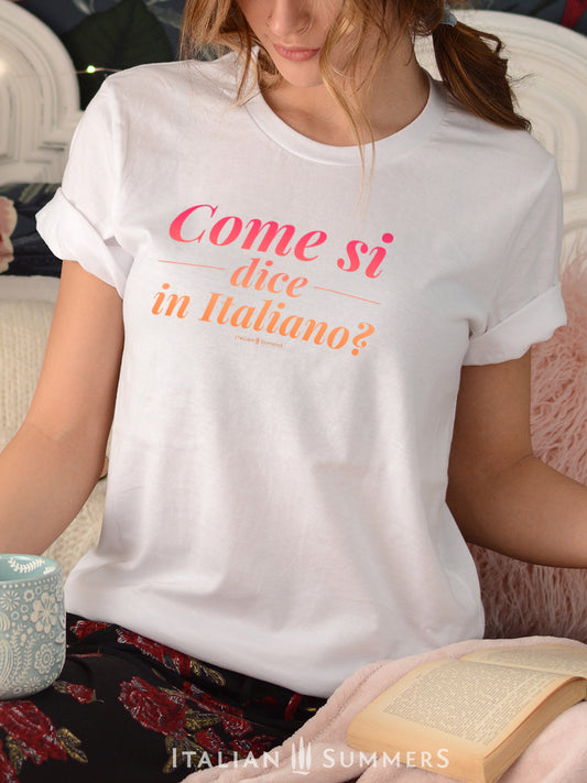 An Italy inspired white cotton unisex T Shirt with a printed pink-orange quote: "Come si dice in Italiano? - "how do you say it in Italian?" for all Italy aficionados