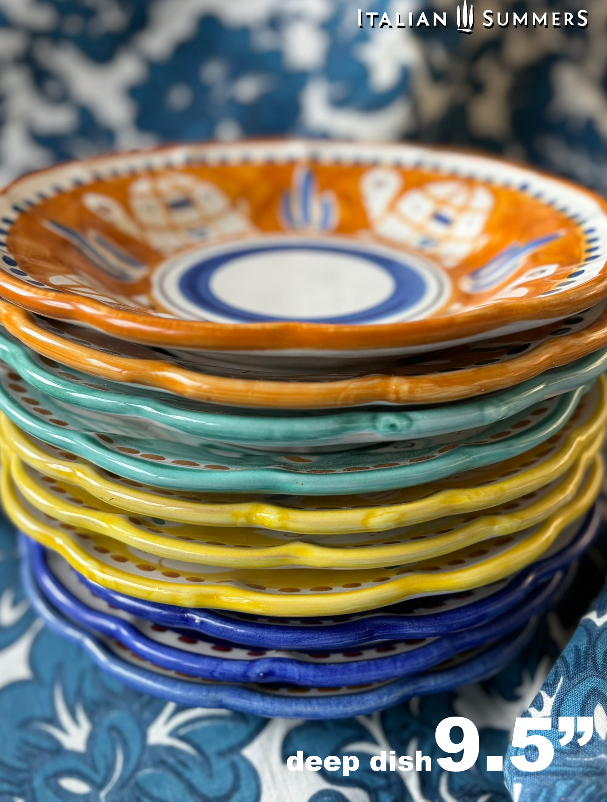 A pile of Colorful hand-painted Vietri Pasta Plates with fish theme decorations from the Amalfi Coast on a blue and white tablecloth