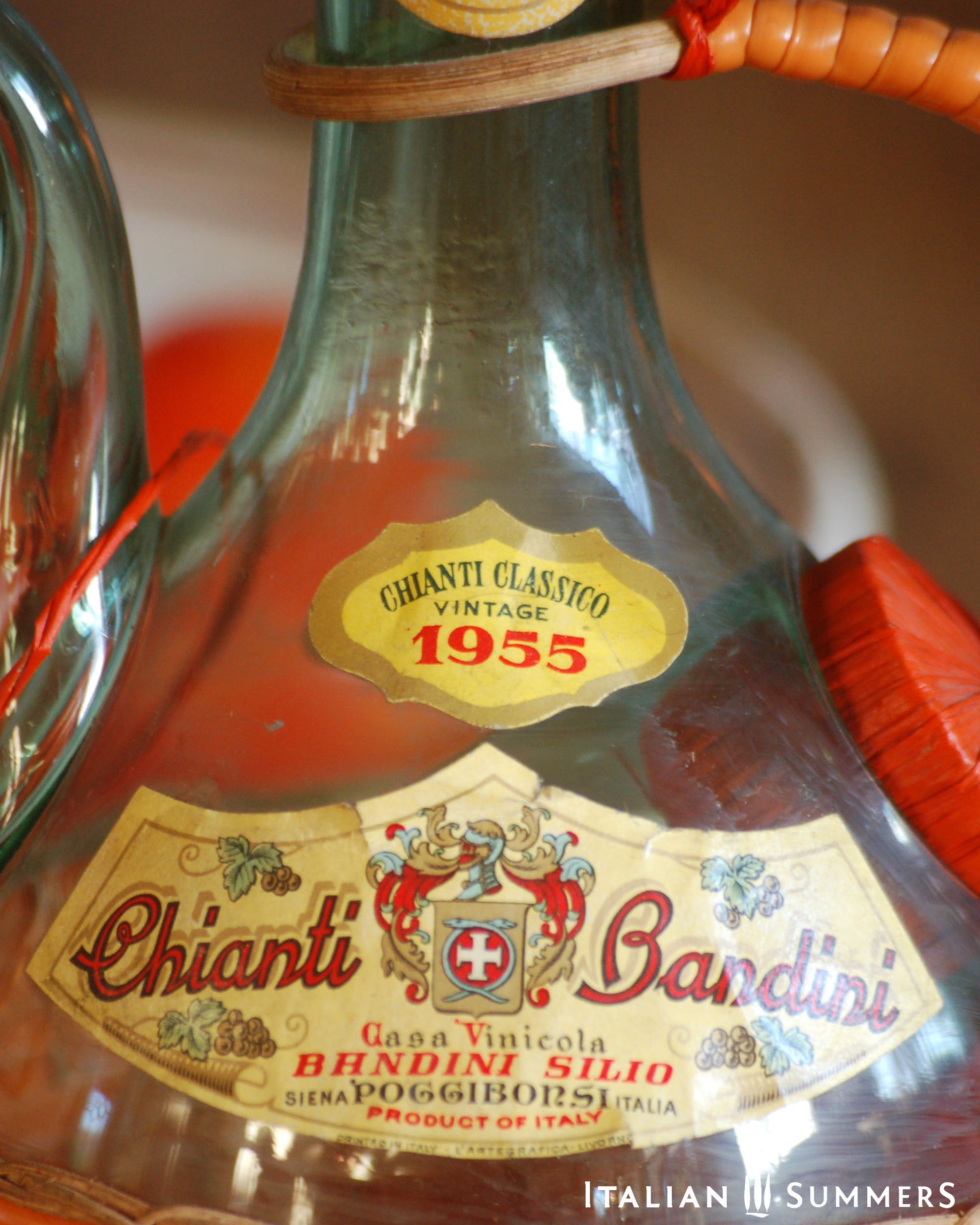 Vintage 1955 Chianti Bandini bottle with decorative label