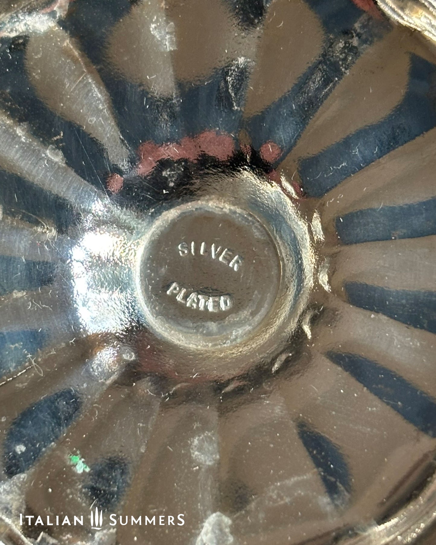 Close-up of a silver dish with 'Silver Plated' text, brand 'Italian Summers' visible.