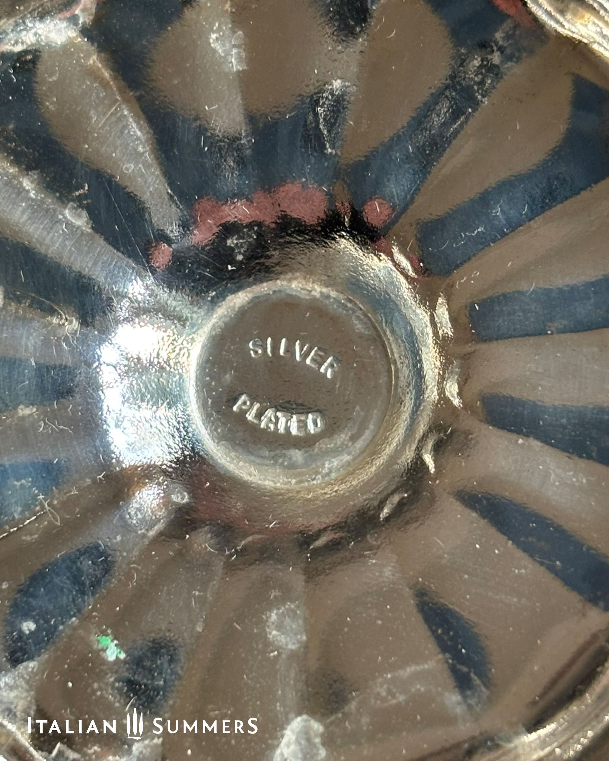Close-up of a silver dish with 'Silver Plated' text, brand 'Italian Summers' visible.