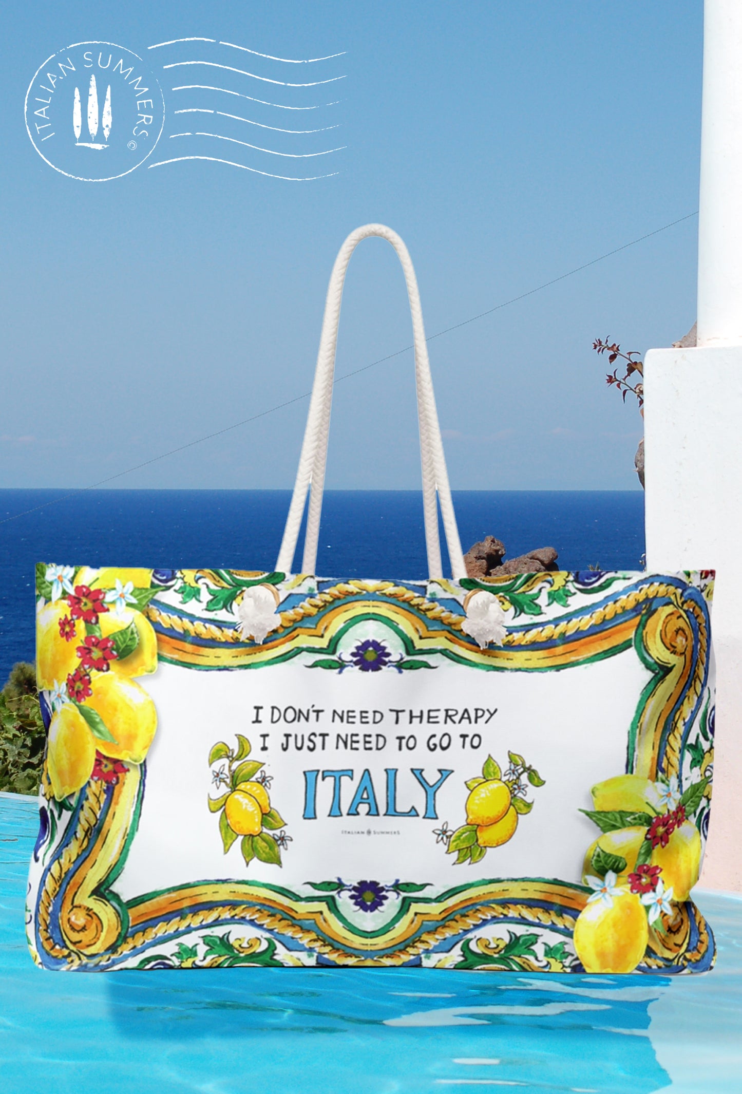 Large Italy inspired beach bag with the quote I don't need therapy, I just need to go to Italy. The Italy is in blue and on both sides of Italy are Sorrento lemons. The rims of the bag are decorated with Sicilian baroque convolutes, lemons and pieces of tiles. Printed on 2 sides. The bag has soft rope handles. 