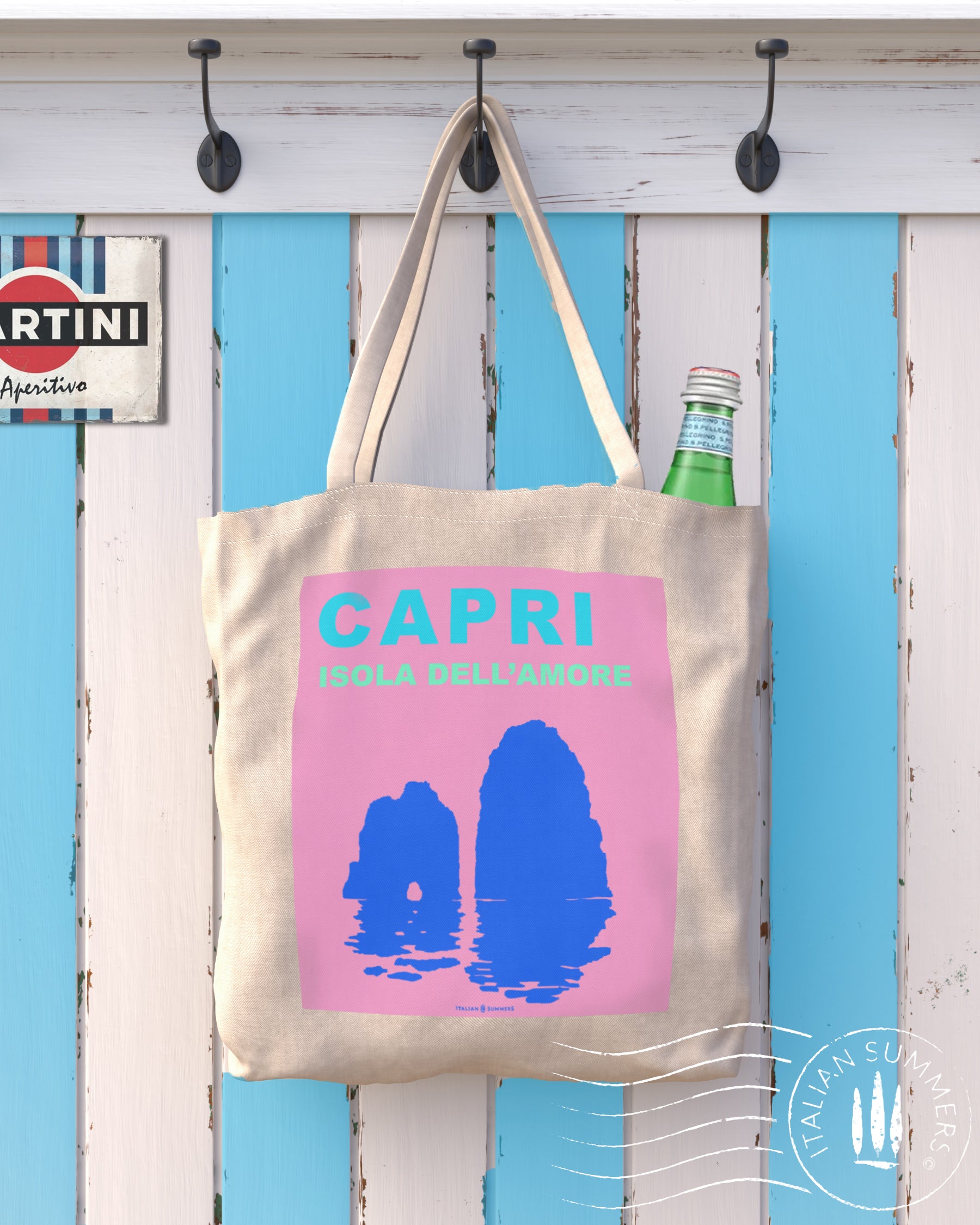 Italy inspired tote bag that represents a lilac field containing a turqoise Capri text and under that the text Isola del Amore means Isand of love. Under the text there is the silhouet of the Faraglioni in cobalt blue color. Designed by Italian Summers
